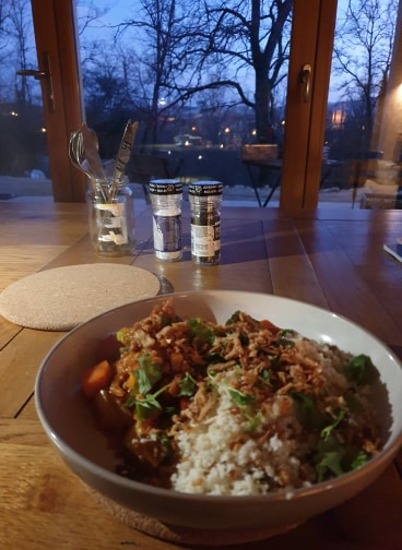 Dinner inside the house as the sun comes down and the village lights up